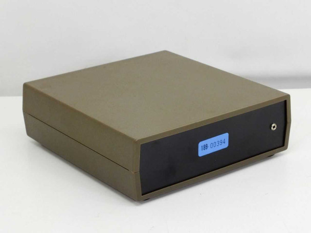 BK Precision 1803 Frequency Counter — rear-left angle view of tan case with small blue asset tag on rear panel