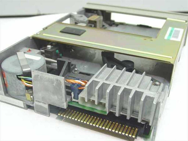 Cipher ST 60B tape drive – top interior view showing drive motor, heat sink fins, ribbon cable, and QIC edge connector interface