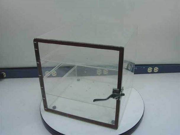 Atmosphere Control Products acrylic tabletop desiccator front view — closed door with latch hardware visible on right side