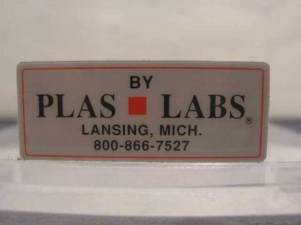 Plas Labs manufacturer label reading 'BY PLAS LABS, LANSING, MICH.' with phone number 800-866-7527