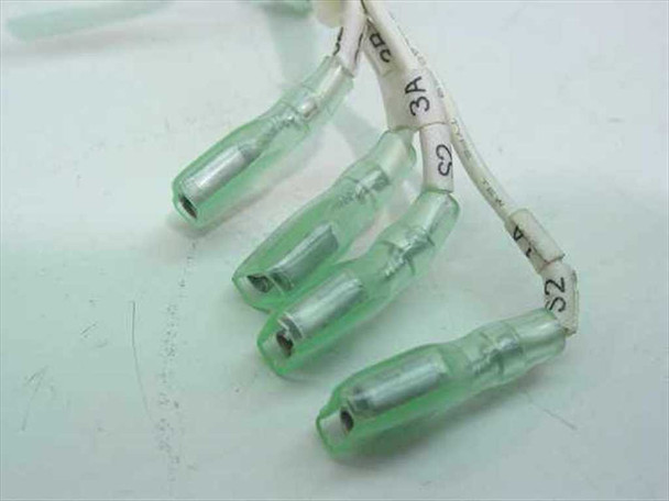 Close-up of green insulated female spade terminals with white heat-shrink wire labels reading S2, S3, 1A, 3A