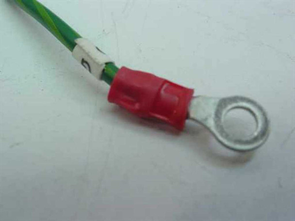 Close-up of green and yellow ground wire with red insulated ring terminal end