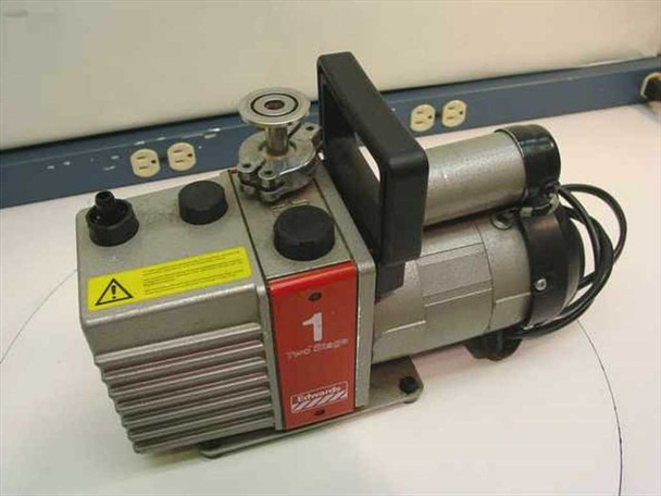 Edwards E2M-1 two-stage rotary vane vacuum pump — right-side view showing motor assembly, pump body fins, carry handle, and inlet/outlet ports