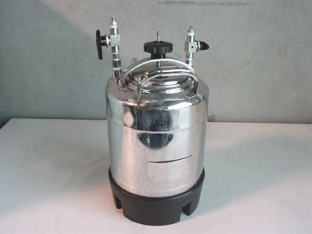 Apache Stainless 90-5304 stainless pressure vessel — front-right view showing bail clamp handle, multiple top-head fittings, and polished 304L stainless body with stamped label
