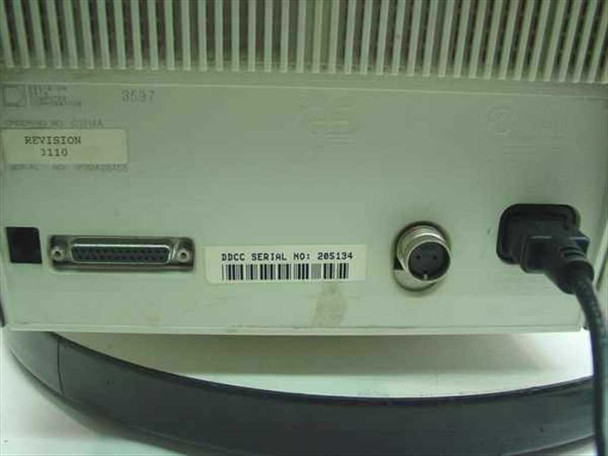 Decision Data 3597 C1014A rear panel showing DB25 port, 5-pin DIN connector, Revision 1110 label, ordering number C1014A label, and attached power cord