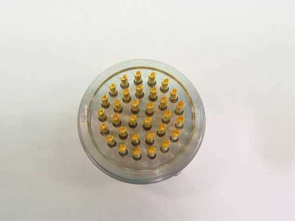 Deutsch 46099-18-32 connector — top-down view through clear protective cover cap showing all 32 gold pin contacts in circular pattern