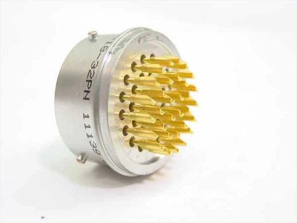 Deutsch 46099-18-32 32-pin circular connector — front face showing gold pin contacts arrayed in brown phenolic insulator, aluminum shell, with partial label markings visible