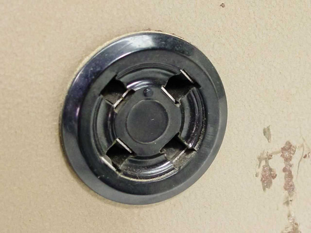 Spectroline 1500 lamp socket closeup — round multi-pin lamp socket on top of beige enclosure with light surface rust around socket ring