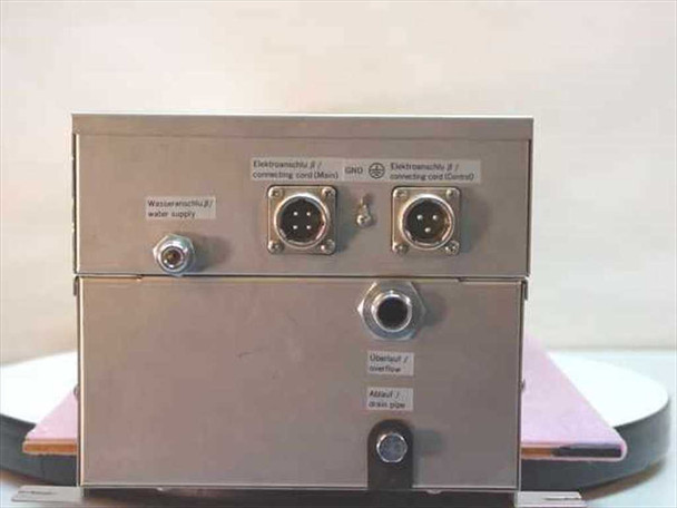 Stulz ENS-24U module rear panel showing water supply inlet, overflow, drain pipe connections, and Main/Control electrical connectors with bilingual German/English labels