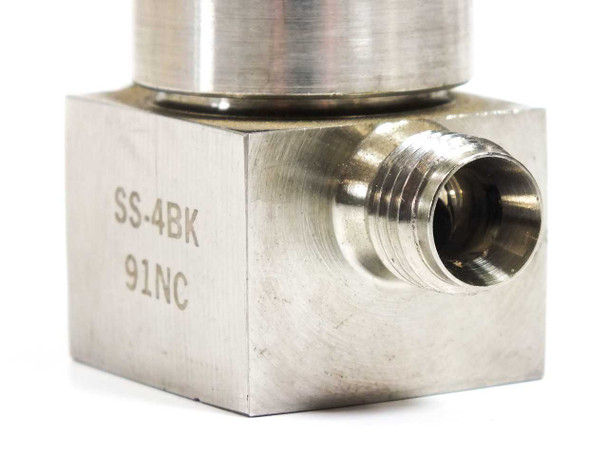 Nupro SS-4BK-91NC bellows valve — close-up of right-side 1/4" NPT port and body engravings SS-4BK 91NC