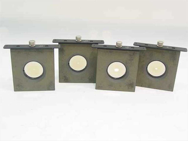Set of four aperture inserts front view showing reflective white/mirror side of aperture openings with thumbscrew retention hardware visible