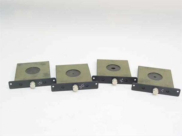 Set of four aperture inserts front view showing black anodized plates with circular aperture openings and degree markings on the mounting brackets