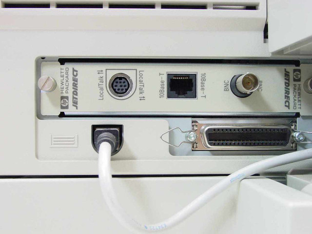 HP JetDirect card rear port close-up showing LocalTalk II DIN, 10Base-T RJ-45, BNC, and parallel Centronics connectors