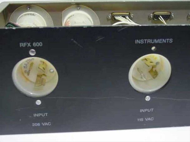 Close-up of RFX 600 208VAC and Instruments 115VAC twist-lock input connectors on front panel face with section labels