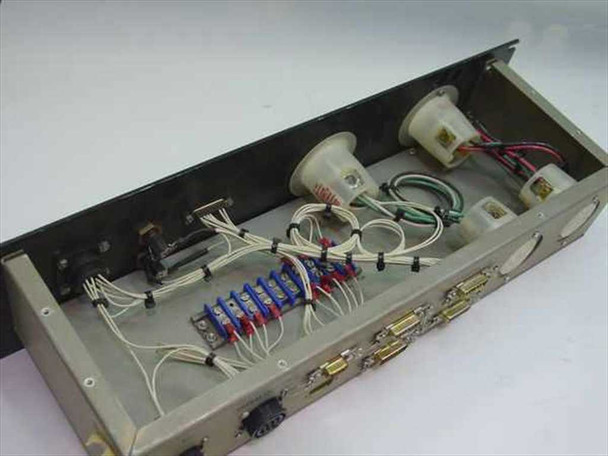 Interior of power distribution panel showing wired terminal blocks, twist-lock outlet bodies, and signal routing wiring