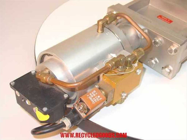 VAT Series 108 UHV gate valve — close-up of pneumatic double-acting cylinder actuator, copper pneumatic tubing, and solenoid valve block with multi-pin electrical connector and yellow indicator tab