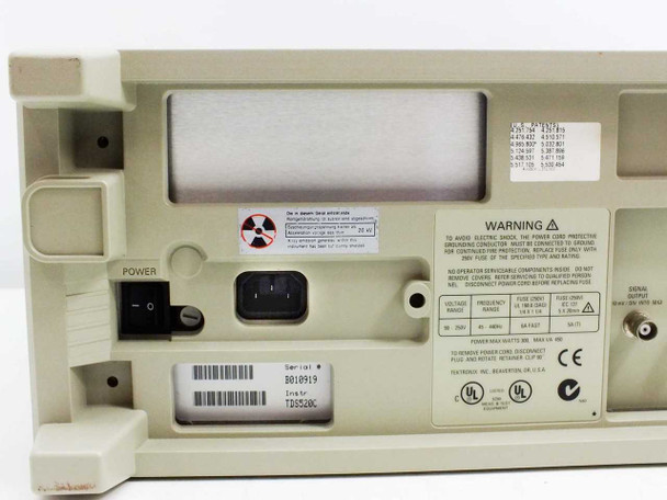 Tektronix TDS520C rear panel close-up showing power rating label, serial number tag, and IEC inlet