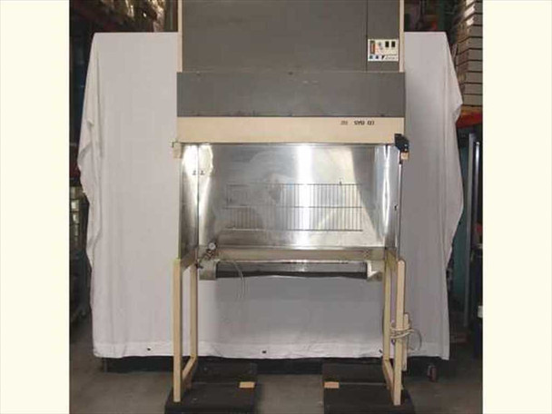 Envirco M424 fume hood with sash raised, showing stainless steel interior work surface and wire shelf