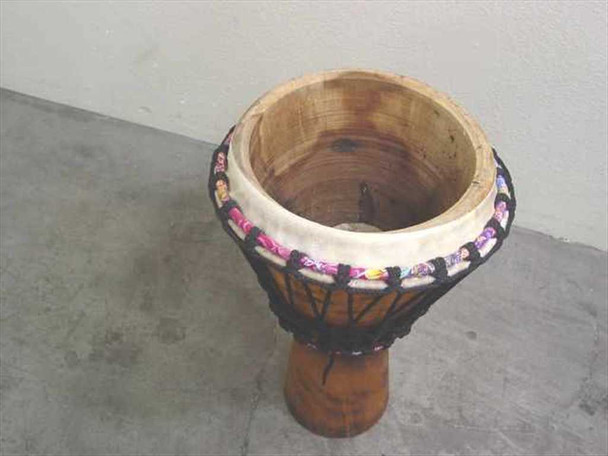 Meinl Headliner HE-DJ12 djembe — top-down view showing open interior of the rubber wood shell and rope tuning ring, no head cover installed