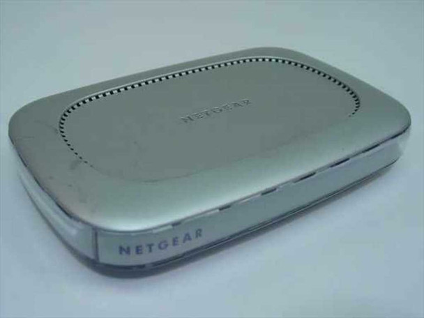 Netgear FS608 8-Port Fast Ethernet Switch — top view showing silver housing and ventilation slots