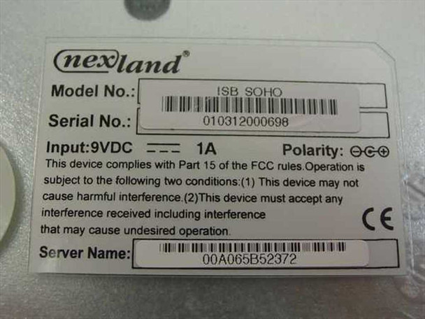 Nexland ISB SOHO router – bottom label showing model number ISB SOHO, serial number, 9VDC 1A power input, FCC compliance, and MAC address