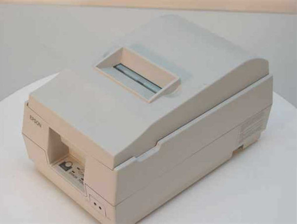Epson TM-U200D M119D dot matrix receipt printer – front and right side view showing paper exit slot, status indicator lights, and Epson logo on beige housing