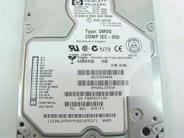 HP D7175-63000 hard drive label close-up showing part numbers, DMVS type, LVD/SE interface, firmware S1A0, and manufacture date