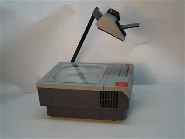 3M 905 Overhead Projector — left rear three-quarter view showing projection arm folded back and fresnel stage with glass platen