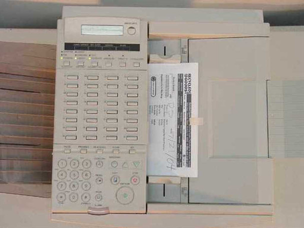 Canon Laser Class 9000L front control panel with LCD display and one-touch dial buttons, test print visible in output tray
