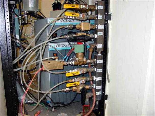 Bosch VS 18C rack interior – CTI Cryogenics controller unit (blue), solenoid valve bank, copper plumbing manifold, and interconnecting wiring