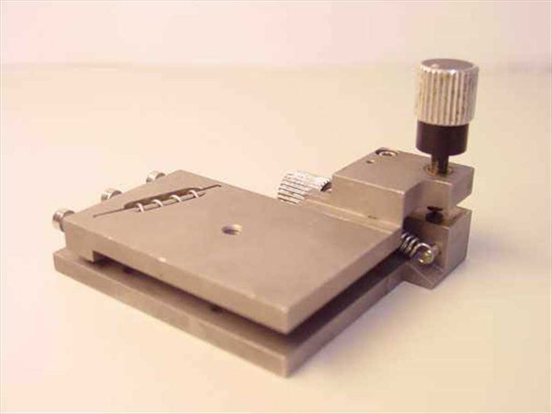 Newport 561-Tilt ULTRAlign tilt rotation stage – three-quarter rear-left view showing flat top platform with center mounting hole and tilt adjustment assembly