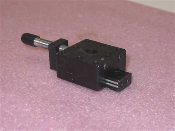 Newport 411-05S miniature linear stage — side view showing ball-bearing rail rods, platform body, and micrometer screw shaft