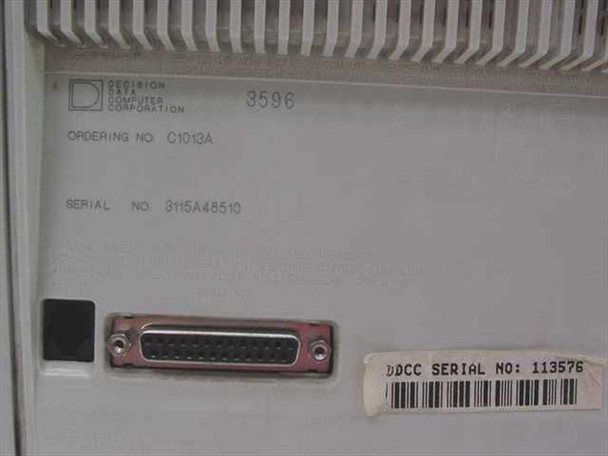Decision Data 3596 rear label close-up showing model 3596, ordering number C1013A, serial number 3115A48510, and 25-pin parallel port