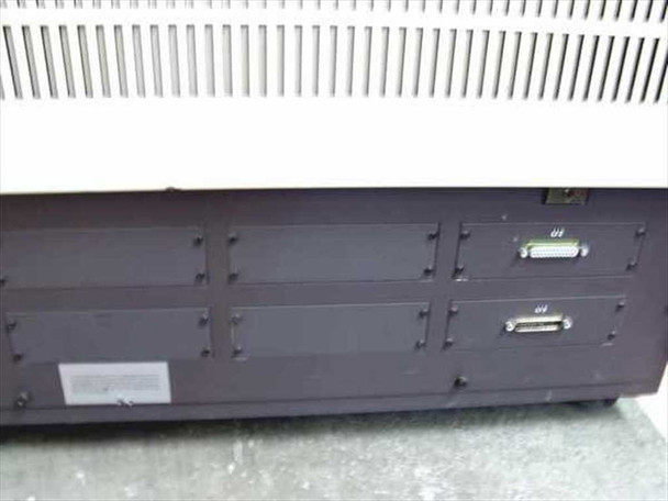 Linotronic 300 rear panel showing two parallel interface port bays (LI 2 upper, LI 5 lower) with expansion slot covers; ventilation grille above
