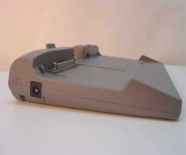 Toshiba PA2718U Port Replicator – opposite side view showing DC power jack and proprietary laptop connection interface