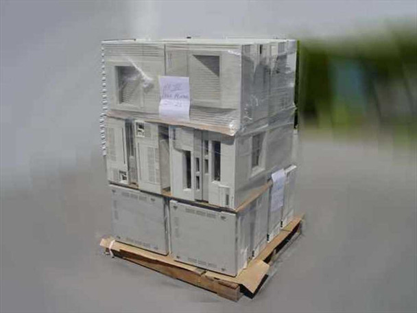 Pallet of HP LaserJet III printers, angled side view showing stacked units with inventory tag attached to wrap