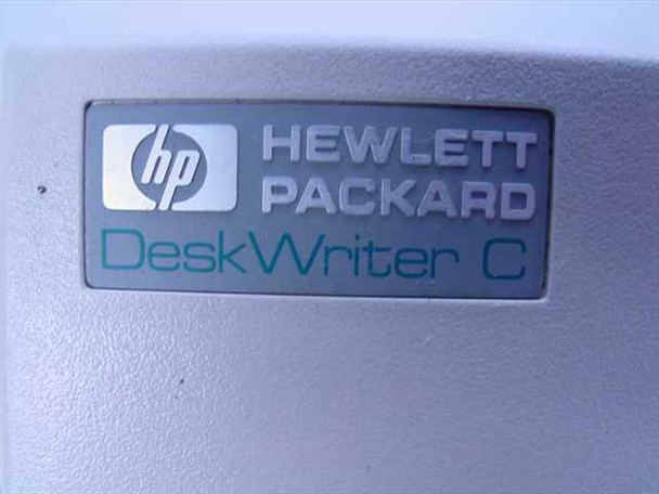 HP DeskWriter C logo badge close-up — Hewlett Packard branding with teal DeskWriter C nameplate
