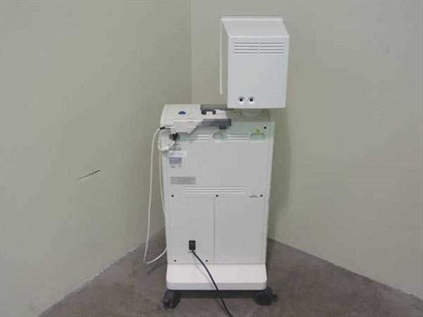 Sirona CEREC 2 dental milling machine — rear view showing back panel with rating labels, power outlet connection, and lower cabinet door