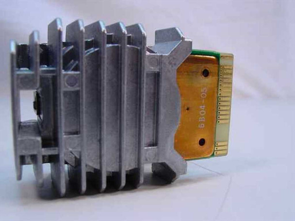 Okidata 50099501 dot matrix printhead rear view showing finned aluminum heat sink and flex cable PCB with date code BB04-05 printed on ribbon