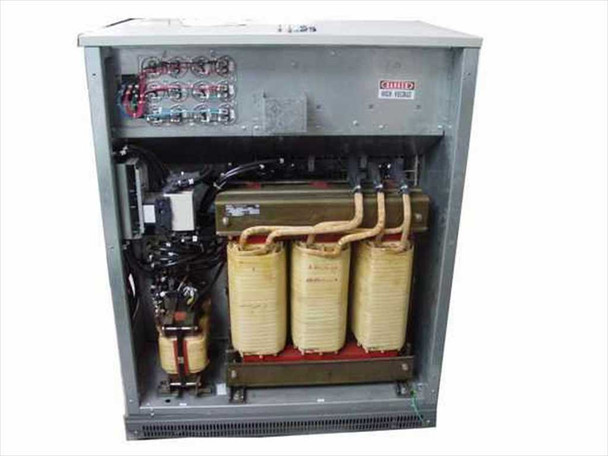 MGE EPS 2000 UPS interior — three large three-phase transformer cores (yellow/tan), power bus bars, capacitor banks, and control wiring