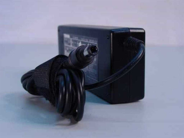 Toshiba PA3201U-1ACA AC adapter — rear view with coiled AC power cord and DC barrel tip connector visible