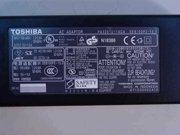 Toshiba PA3201U-1ACA rating label closeup — shows Input 100-240V 1.2-0.6A, Output DC 15V 5A, model and certification markings