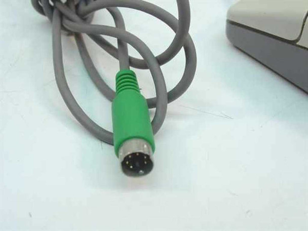 Compaq MUS9J PS/2 mouse green mini-DIN 6-pin connector close-up showing pin layout