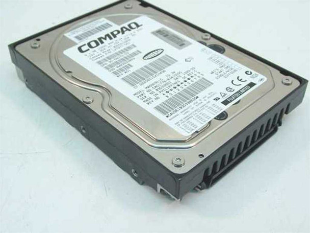 Compaq 127977-001 9.1GB Wide Ultra2 SCSI 3.5-inch hard drive – angled top view showing Compaq label and drive carrier