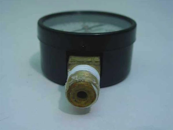 USG P500 pressure gauge angled side view showing case depth, brass NPT fitting with PTFE tape, and bottom-mount connection