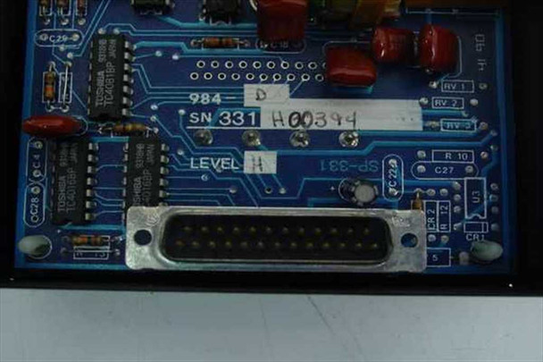 DMP 984-D Communication Module PCB close-up showing model label '984-D', serial number tag, LEVEL H marking, and DB25 D-sub connector