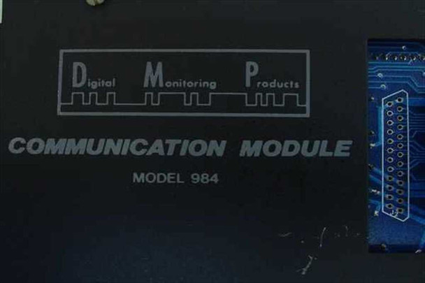 Digital Monitoring Products DMP Communication Module Model 984 – front panel close-up showing engraved DMP logo and MODEL 984 label