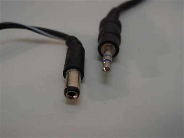 Close-up of included audio cable connectors: barrel jack (left) and 3.5mm stereo plug (right)