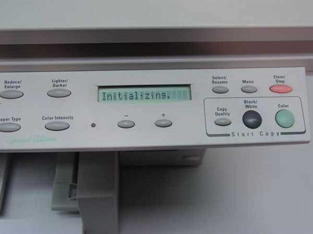 HP OfficeJet Pro 1150Cse control panel close-up showing LCD display reading Initializing with copy and menu buttons