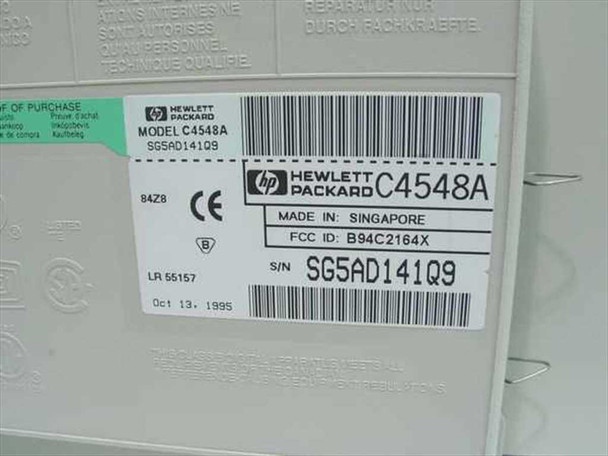 HP DeskJet 660Cse bottom label showing model C4548A, serial number SG5AD141Q9, Made in Singapore, FCC ID B94C2164X, dated October 13 1995